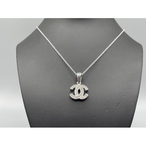 18 - Silver and CZ channel style pendant and chain 7.1g