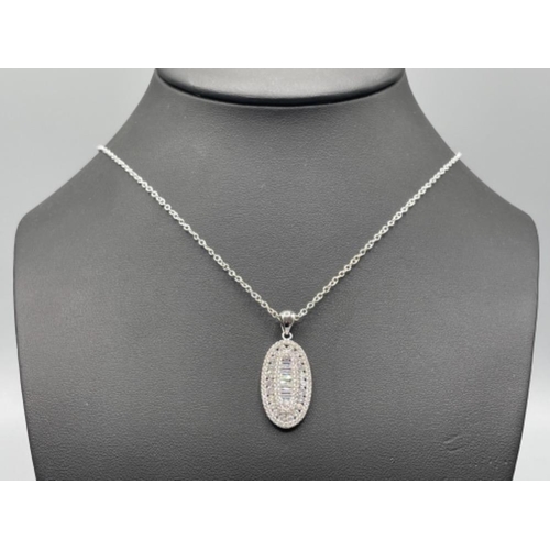 21 - Silver and CZ pendant and chain