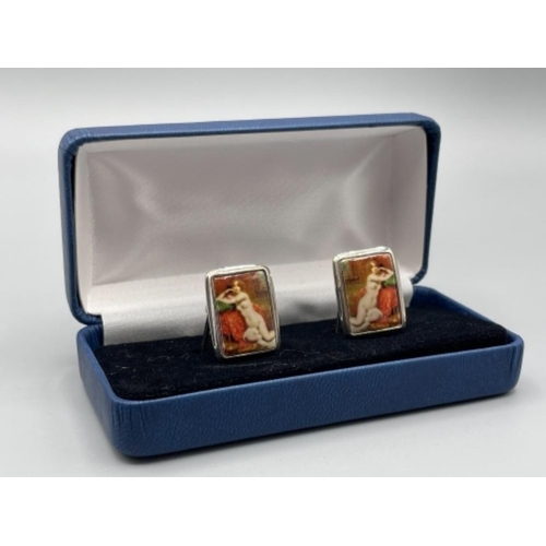 22 - Pair of silver and enamel cuff links depicting nude woman