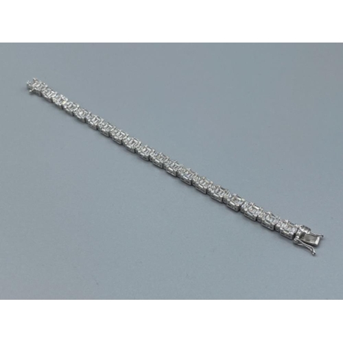 25 - A good silver and CZ line bracelet