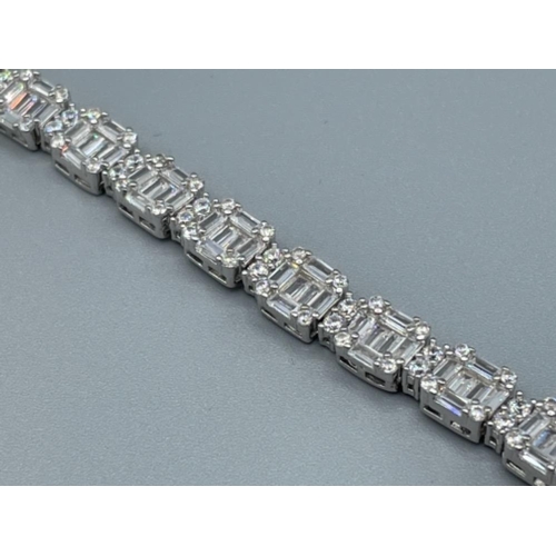 25 - A good silver and CZ line bracelet