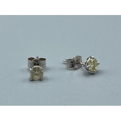 28 - Pair of 14ct white gold diamond stud earrings .50ct