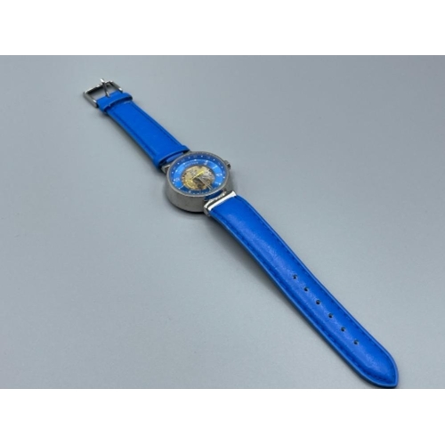 31 - Steel cased wristwatch on blue leather strap