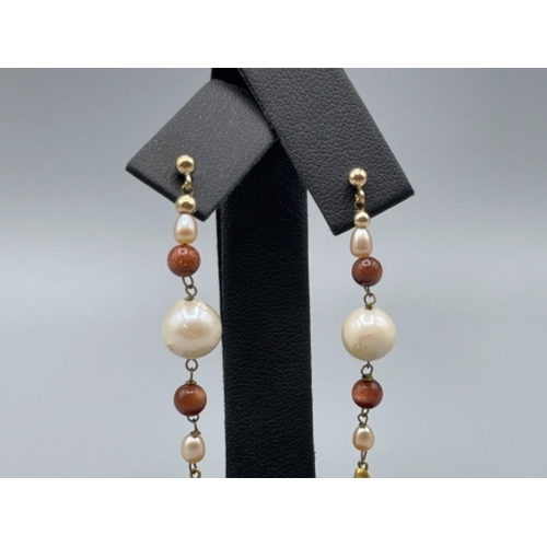 34 - Pair of gold and pearl drop earrings