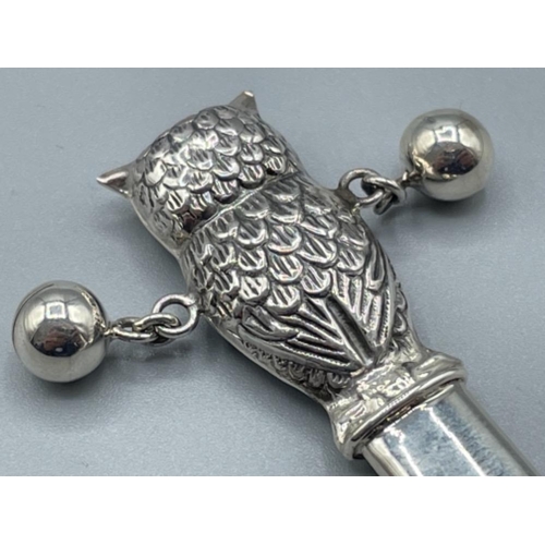 36 - Silver babies rattle in the form of an owl with mother of pearl handle