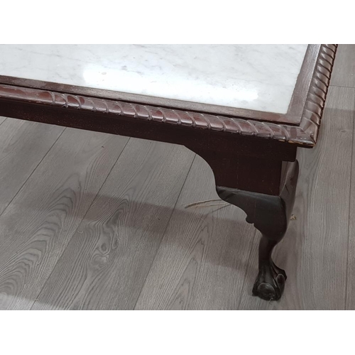 386 - Mahogany framed marble top coffee table with claw and ball feet, 91x70cm H40