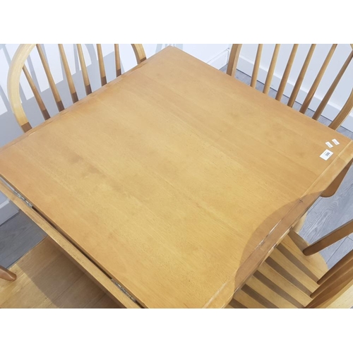 390 - Malaysian rubberwood drop leaf kitchen table and 4 matching Windsor back chairs, 120x76cm