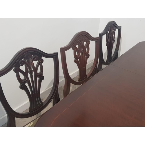 391 - Large extending mahogany dining table and 8 shield back chairs, 2 carvers 6 singles with extra leaf,... 