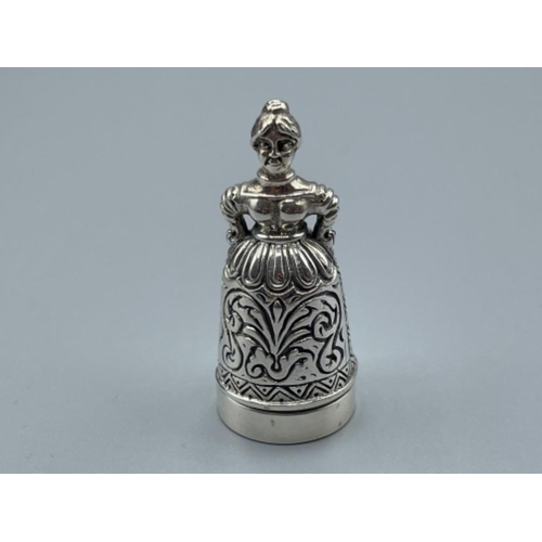 8 - Silver thimble and pin cushion in the style of woman