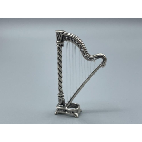 9 - An unusual silver figure of a Harp 14g