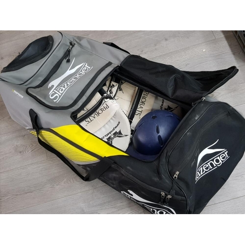 123 - Bag of cricket gear incl protective gear, hats, pads etc plus bats