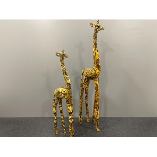 142 - Pair of Collage Giraffes in good condition 79cms and 62cms