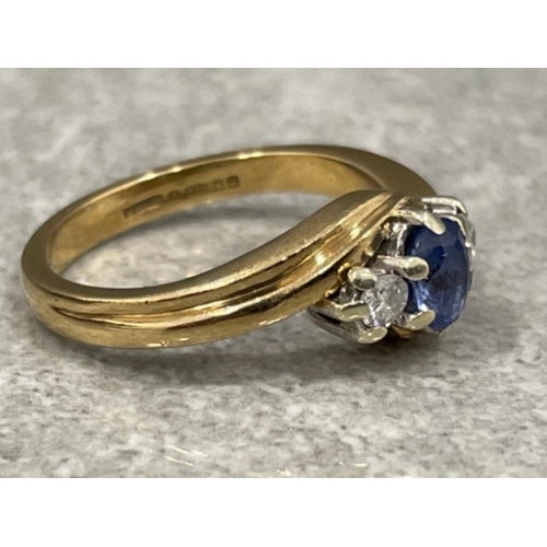 72 - 9ct gold diamond and sapphire twist ring. 3.5G size K