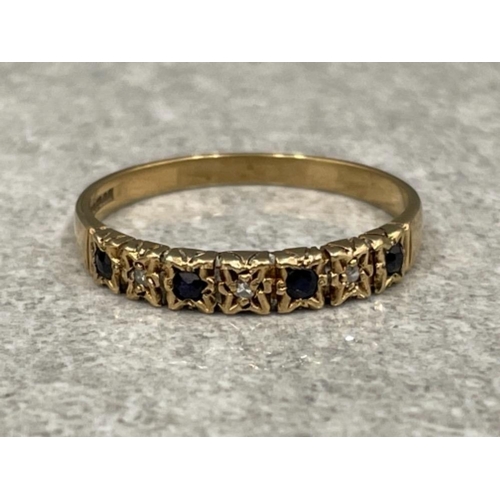 73 - 9ct gold sapphire and diamond band. Featuring 4 black sapphires set with diamonds in between. 1.9g s... 