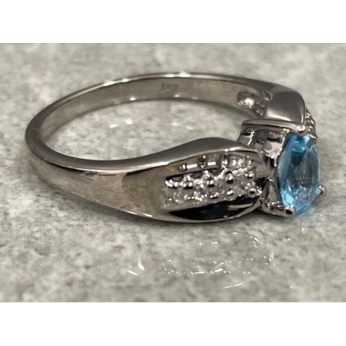 80 - Ladies 14ct white gold blue stone and diamond ring. 3.6g size N