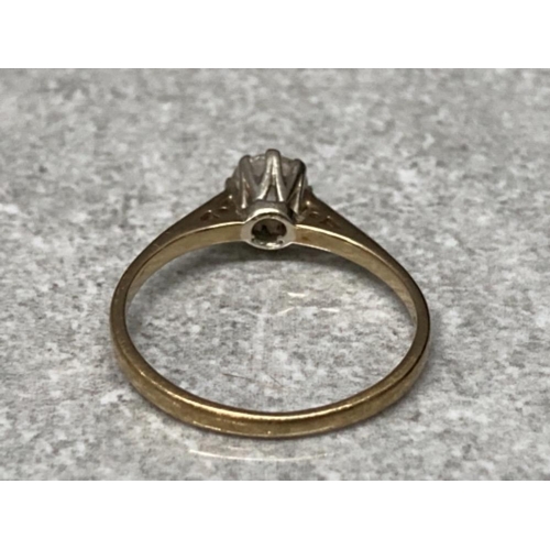 124 - A 9ct yellow gold and diamond solitaire ring stamped .50 size M1/2 1.7g gross