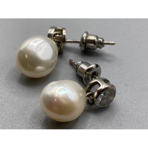 127 - A pair of silver CZ and freshwater Pearl drop earrings