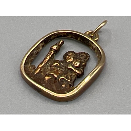 167 - 9ct gold St Christopher medallion. 2.6g