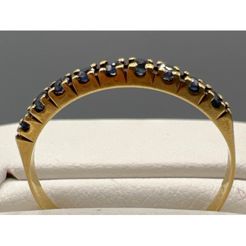 191 - 18ct gold sapphire half eternity ring. 1.2g size O