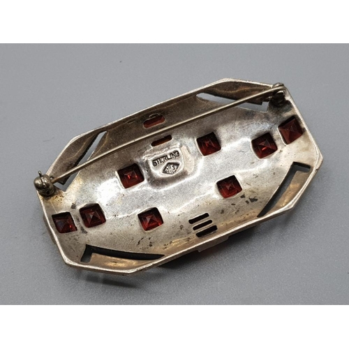 203 - Ladies silver marquisette red stone ornate brooch, set with 14 square red shaped stones set around t... 