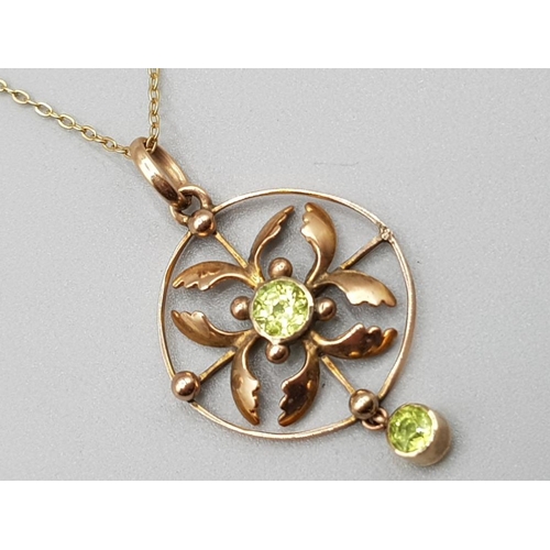 210 - Antique Ladies 9ct yellow gold peridot pendant & chain, featuring a round ornate pendant set with 2 ... 