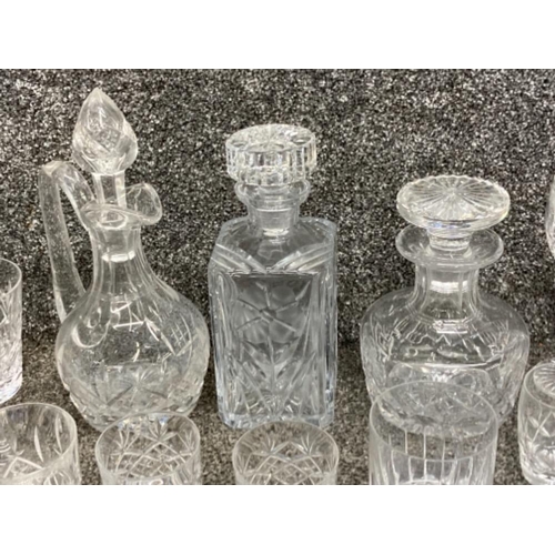 224 - Cut glass decanters and claret jug one by Stuart together with various drinking glasses