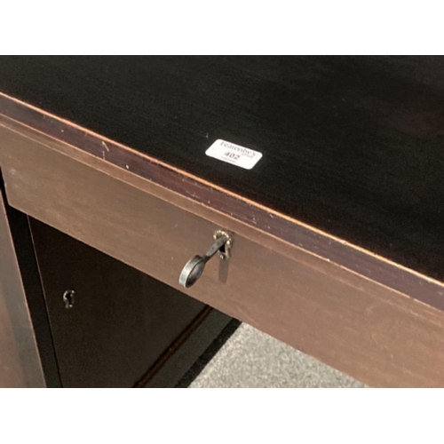 402 - A stained solid oak pedestal solicitors desk with key