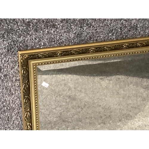 407 - Two bevelled gilt wall mirrors