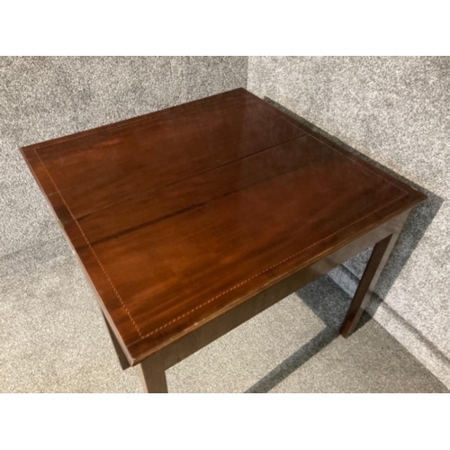 409 - An Edwardian inlaid mahogany turnover top tea table