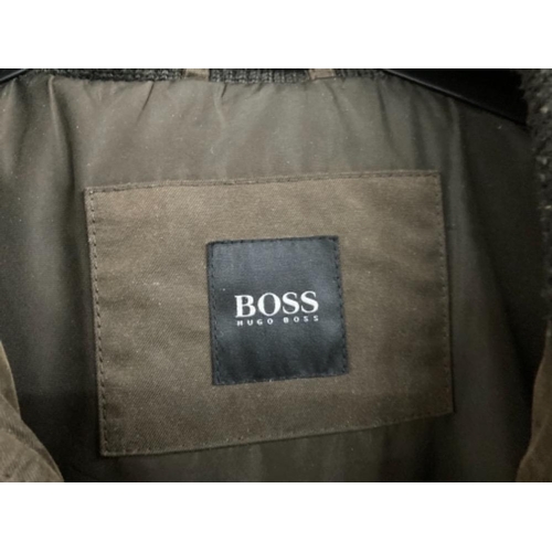 43 - A gents jacket by Hugo Boss, and a leather jacket by Demure