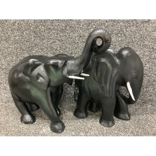 53 - Two heavy carved wood elephants