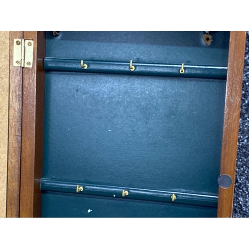 7 - Mahogany glass display fronted hanging cabinet, with golfing themed display