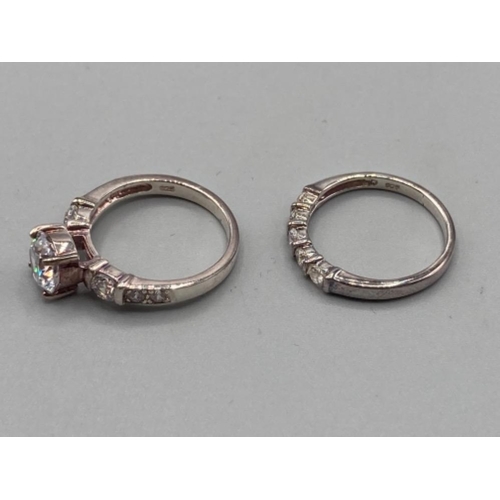 123 - Two silver and CZ rings sizes K and J 4.9g gross