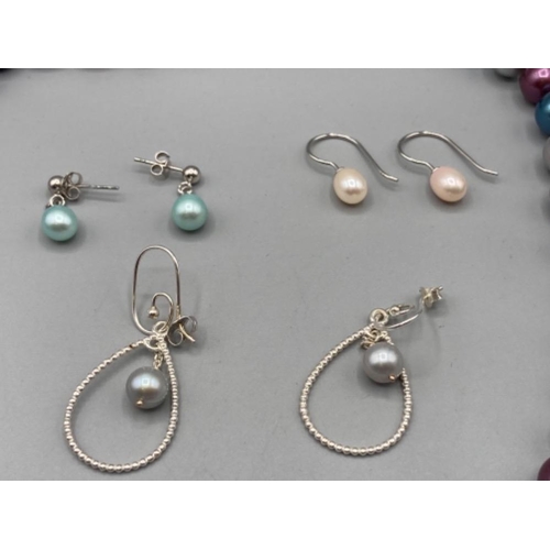 139 - Pearl jewellery: a necklace with silver clasp and three pairs of pearl and silver earrings