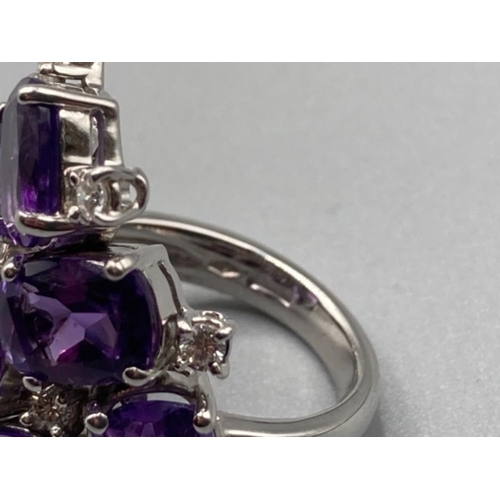 165 - Ladies 18ct white gold ornate purple stone and diamond cluster ring size N 14.5g gross