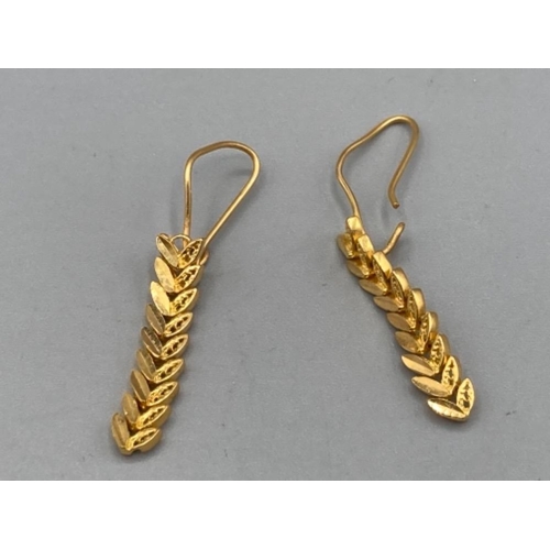 191 - A pair of soft yellow metal earrings of leaf design