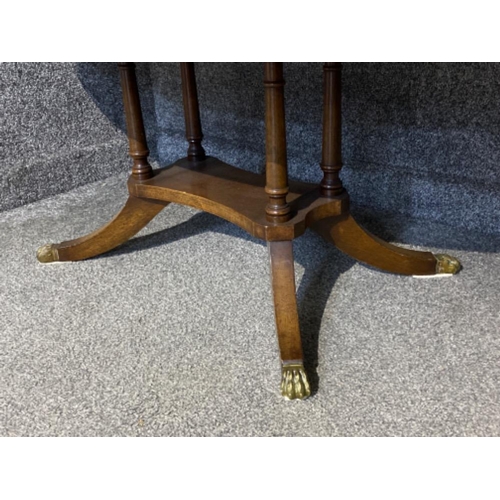 410 - Oval shaped mahogany glass topped coffee table with brass inlay