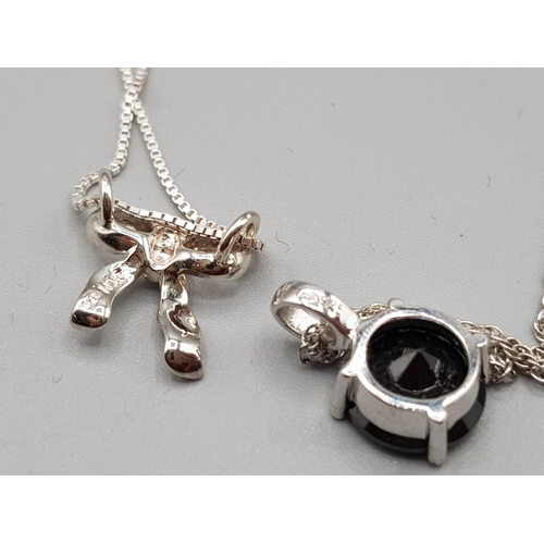 53 - Two silver pendants and three silver chains