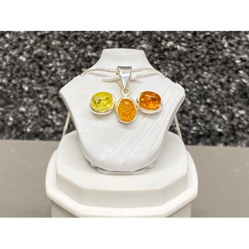 68 - Silver & 3 stone faux amber pendant on 20” silver chain,