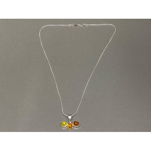 68 - Silver & 3 stone faux amber pendant on 20” silver chain,