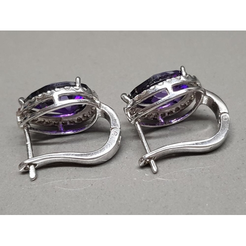 70 - Pair of Silver & Amethyst earrings surrounded by CZ stones, 10.7g gross