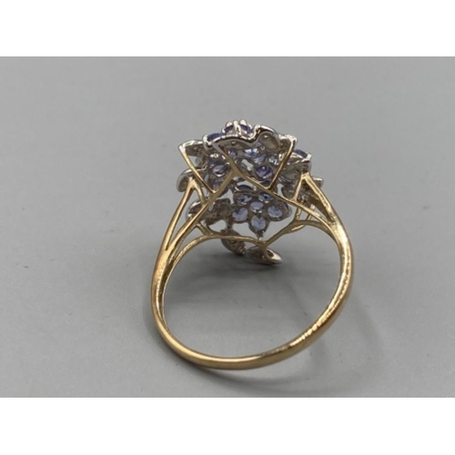 73 - A 9ct yellow gold purple stone and diamond cluster ring size U 3.3g gross