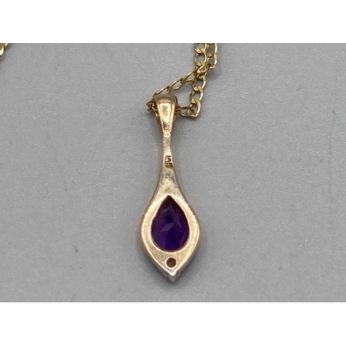 78 - A 9ct yellow gold diamond and purple stone pendant on 9ct gold chain 2.2g gross