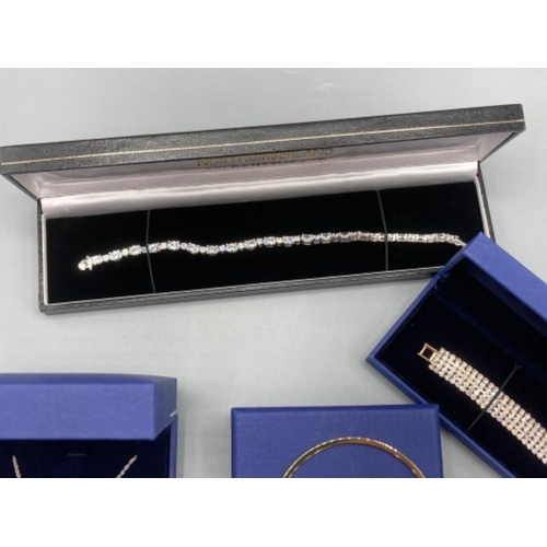 Three items of Swarovski jewellery and a silver and CZ tennis bracelet