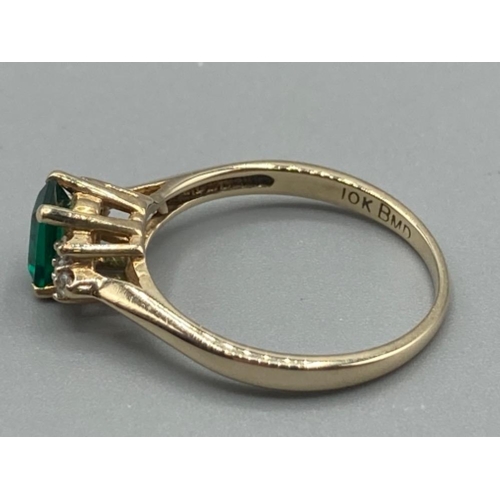 106 - Ladies 9ct yellow gold green stone and diamond ring size O 2.2g gross