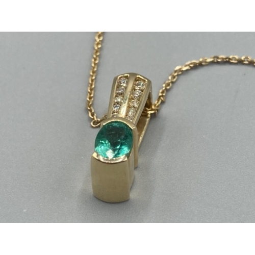 134 - Ladies 14ct yellow gold emerald and diamond pendant and on 9ct gold chain 6.6g gross