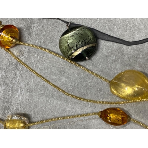 270 - Murano glass pendant attached to a ribbon with silver fitting, plus one other Murano glass beaded ne... 