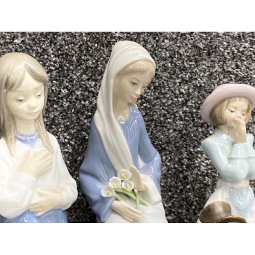 275 - Lladro figure 4972 sitting girl with lilies together with 2x Nao figures & Goebel Hummel figure