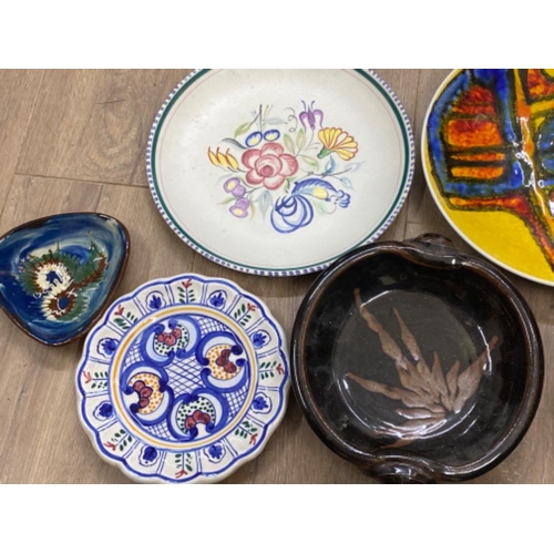 298 - Studio pottery & Poole plates, 7 items in total