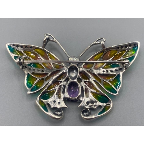 67 - A silver and plique a jour butterfly brooch with amethyst cabochon,12.2g